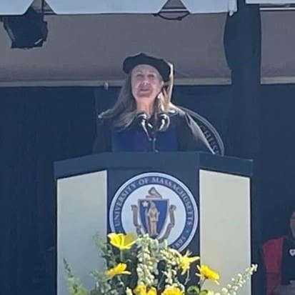 Woman speaking at University of Massachusetts graduation.