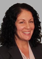 Headshot of a woman with dark hair.