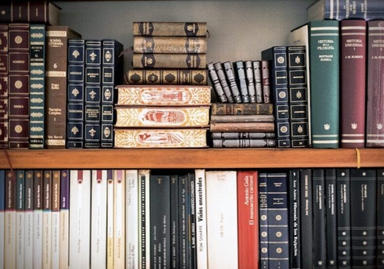 A bookshelf with many books on it